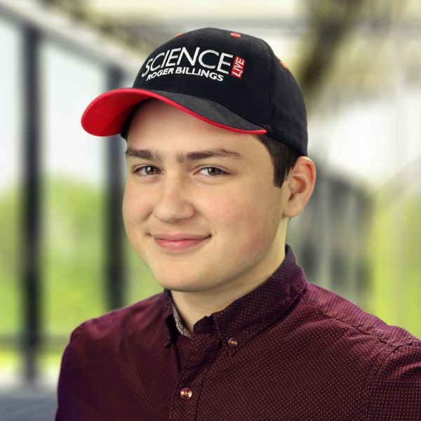 A young man wearing a black Science Live baseball cap