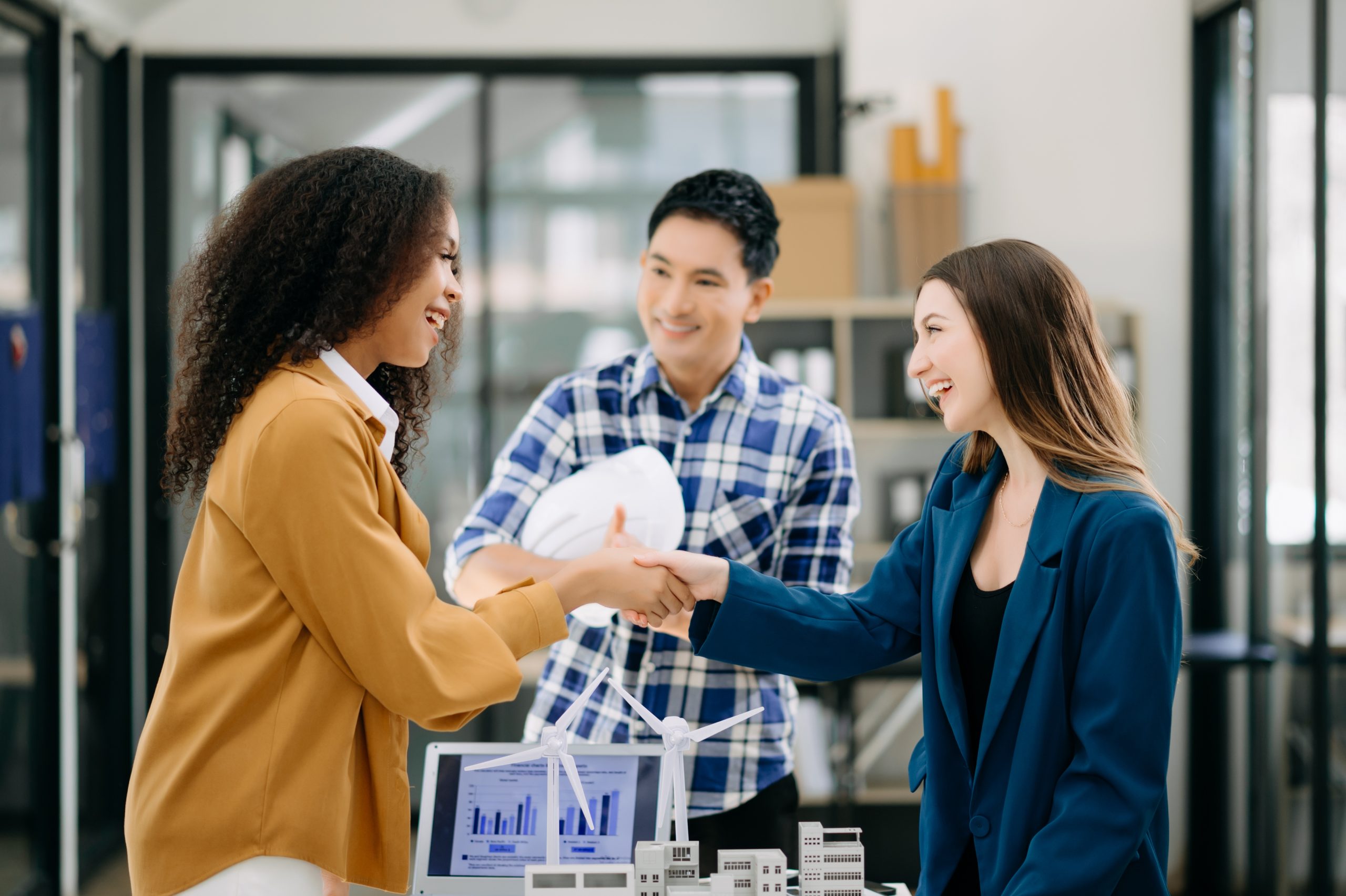 business people shaking hands during a meeting in office